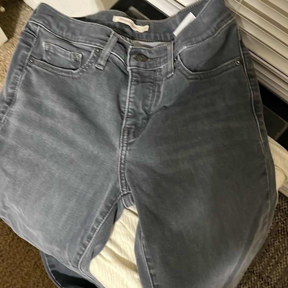 Size 25 distressed black 311 shaping skinny jeans